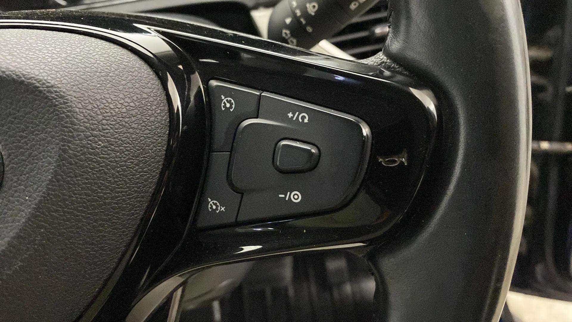 Steering wheel control close-up of a Tata Nexon 2017-2023