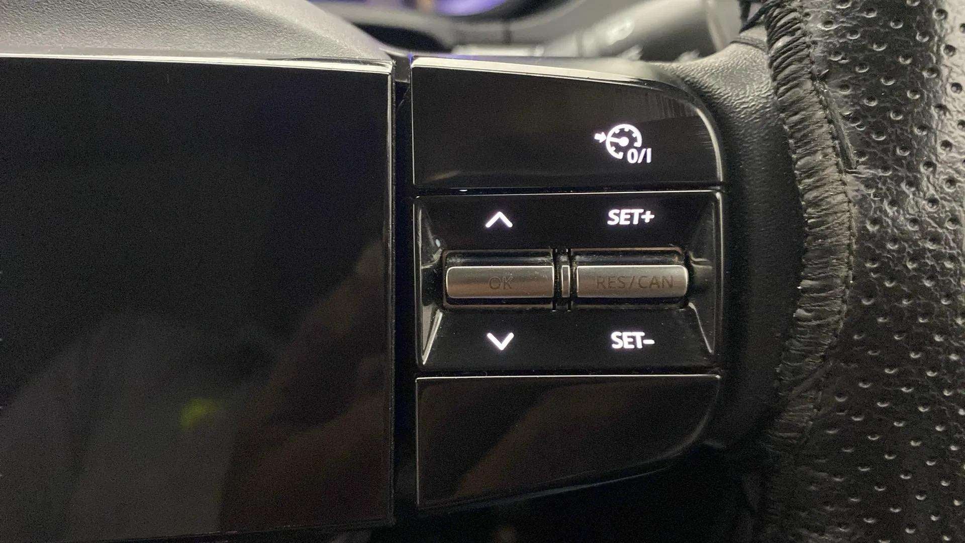 Steering wheel cruise control buttons of a Tata Nexon 2017-2023