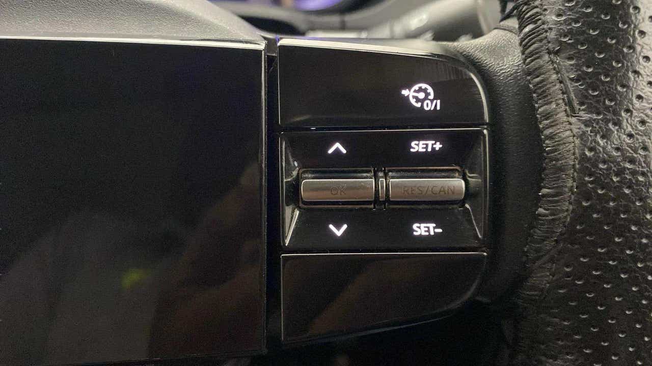 Steering wheel cruise control buttons of a Tata Nexon 2017-2023