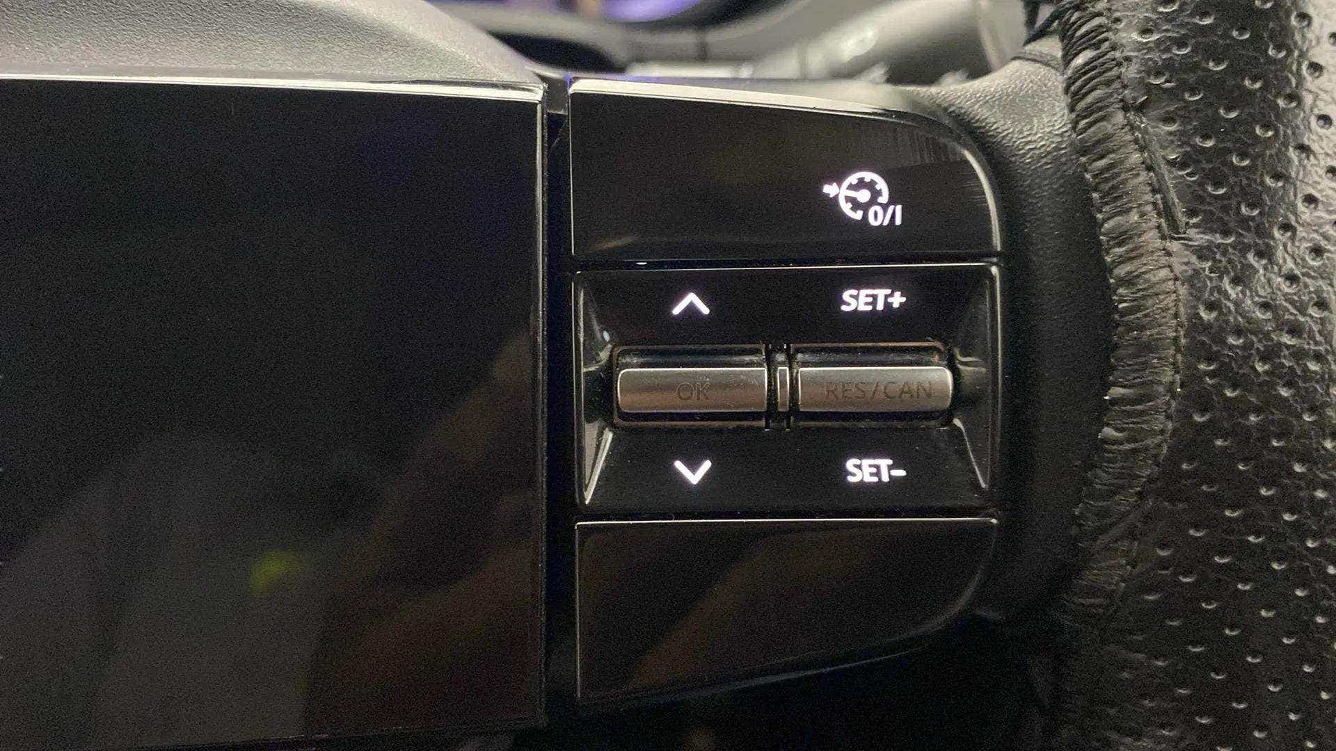 Steering wheel cruise control buttons of a Tata Nexon 2017-2023