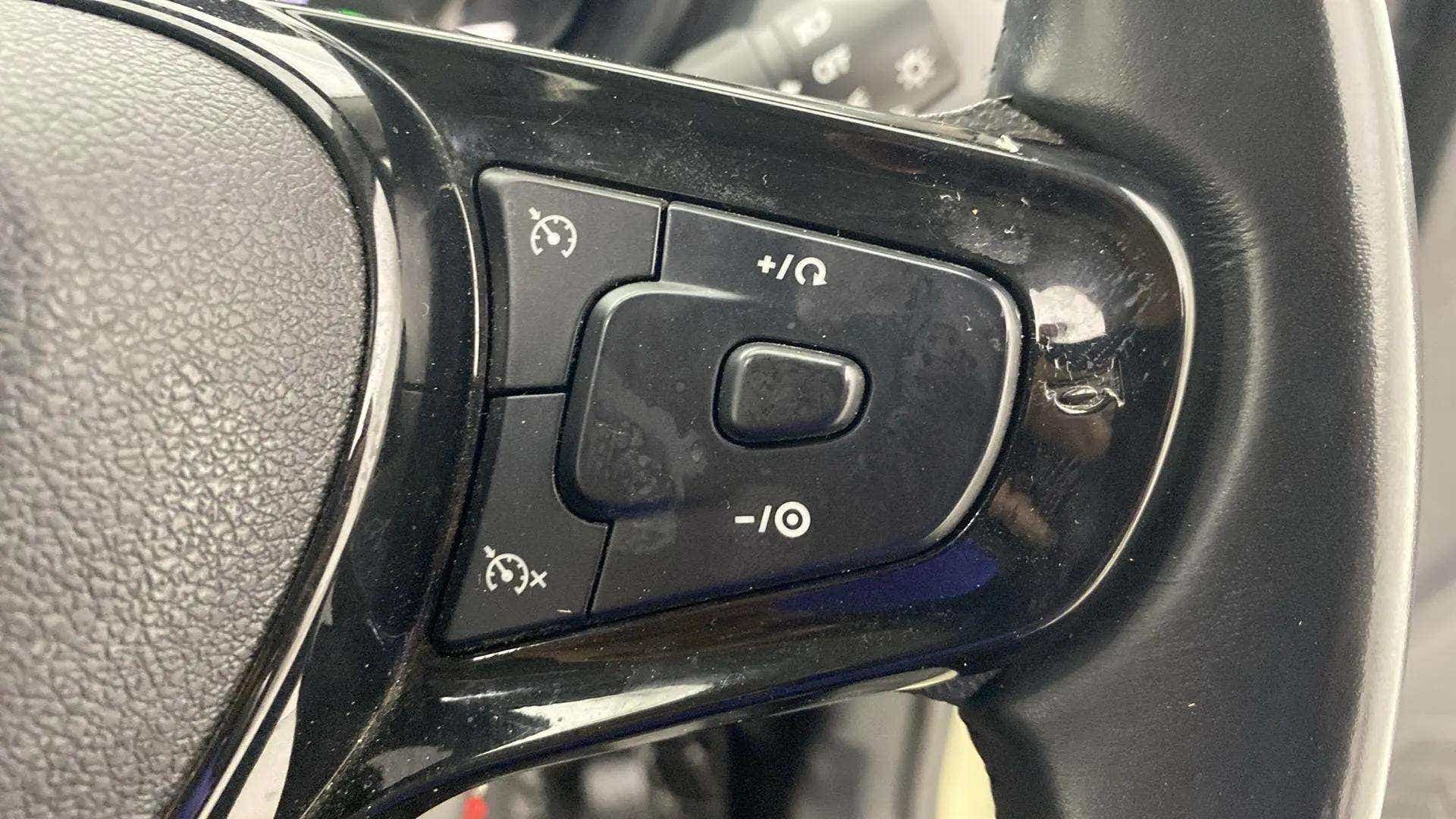 Steering wheel cruise control buttons of a Tata Nexon 2017-2023