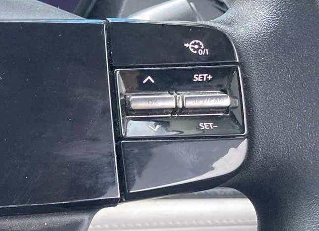 Steering wheel cruise control buttons of a Tata Nexon