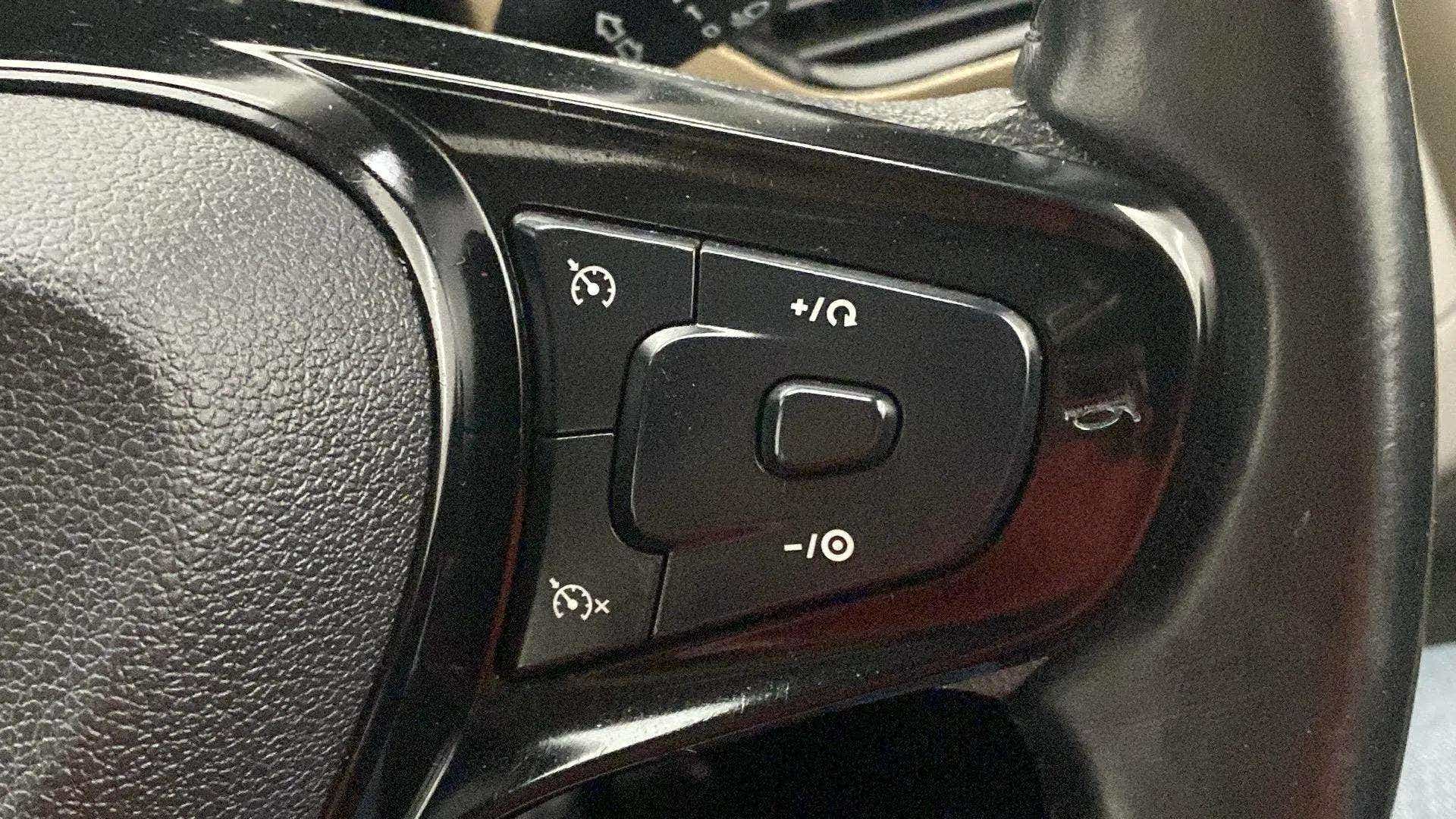Steering wheel cruise control buttons of a Tata Nexon 2017-2023