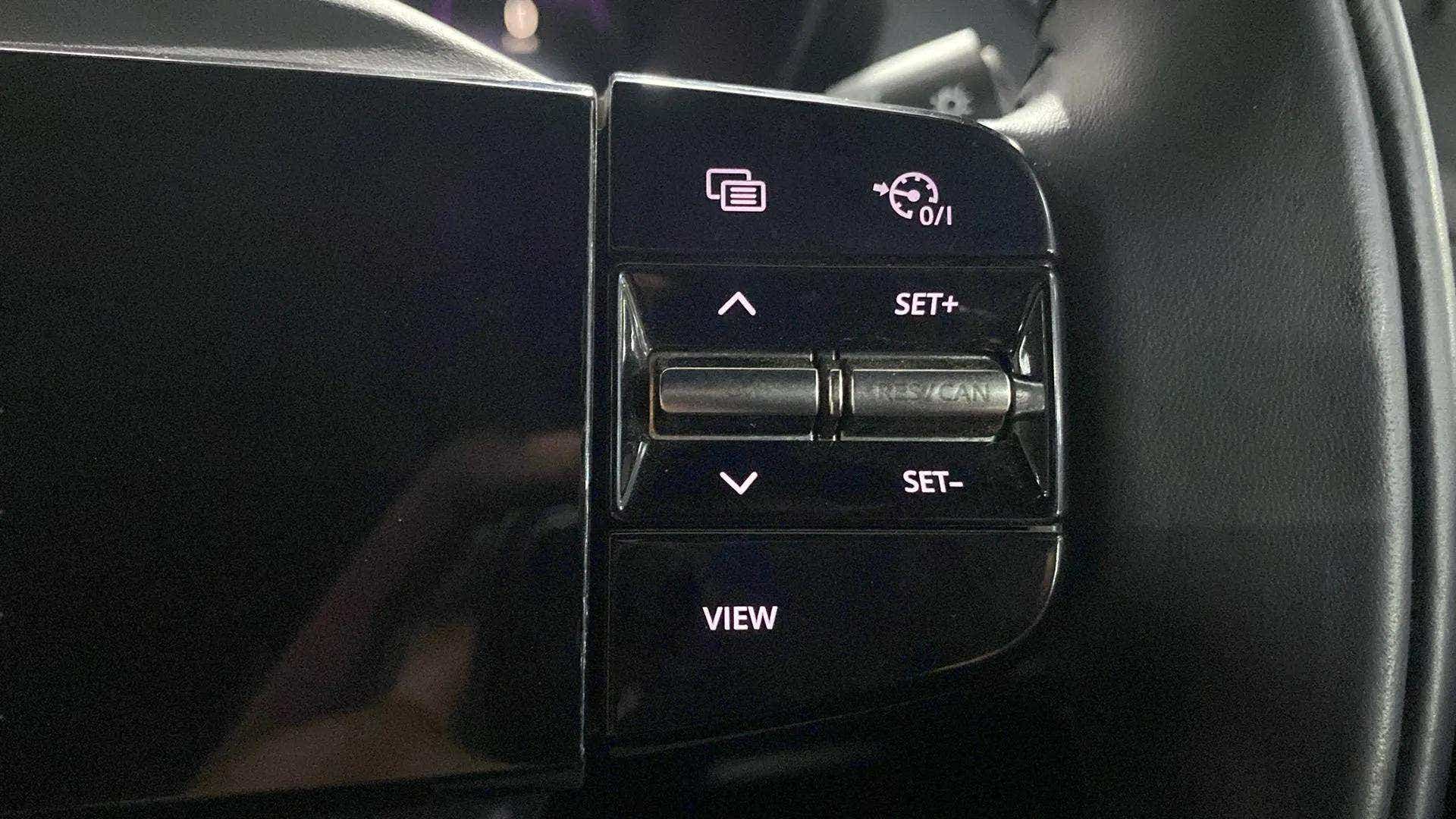 Steering wheel cruise control and view buttons of a Tata Nexon 2017-2023