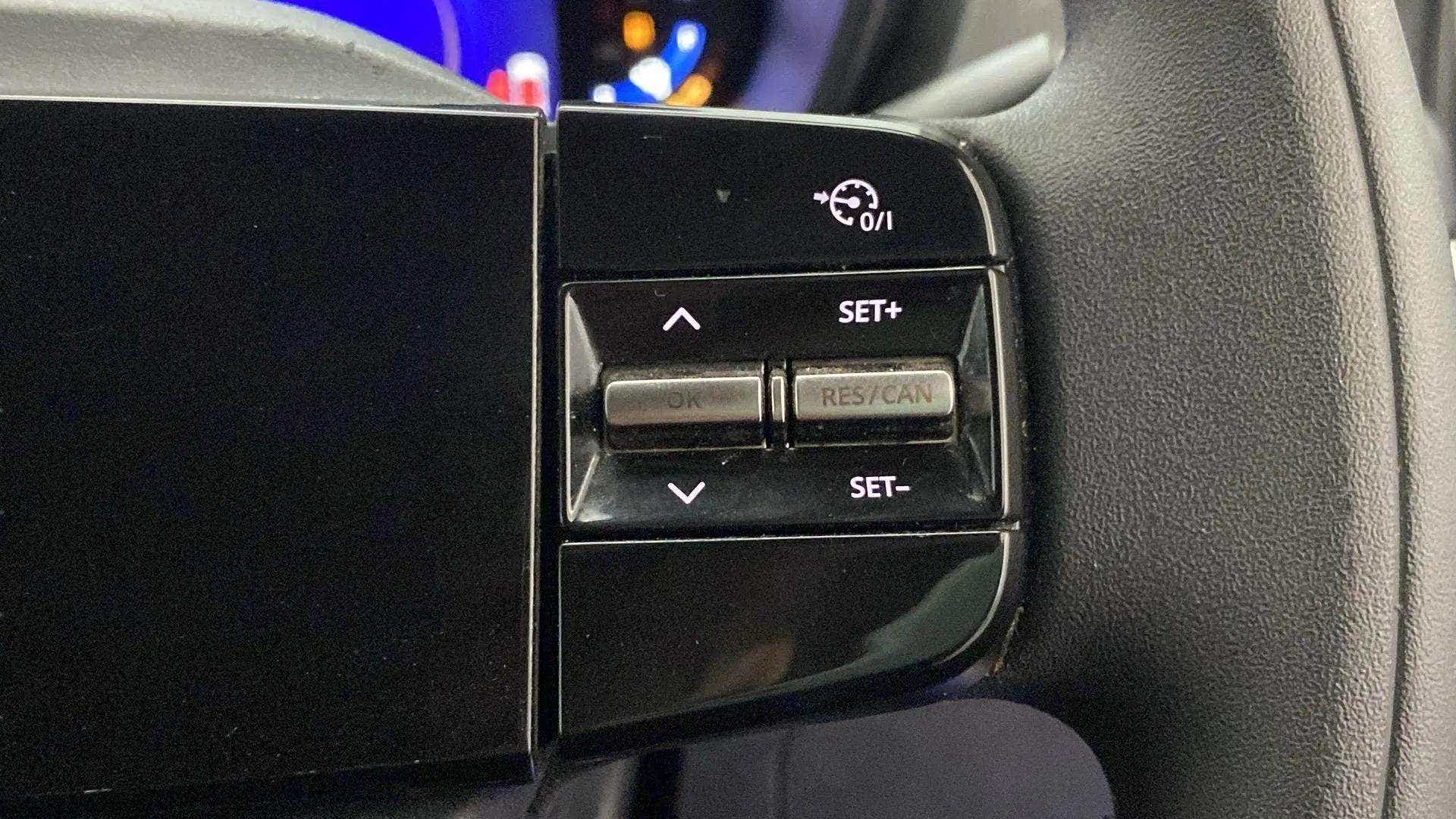 Steering wheel cruise control buttons of a Tata Nexon 2017-2023