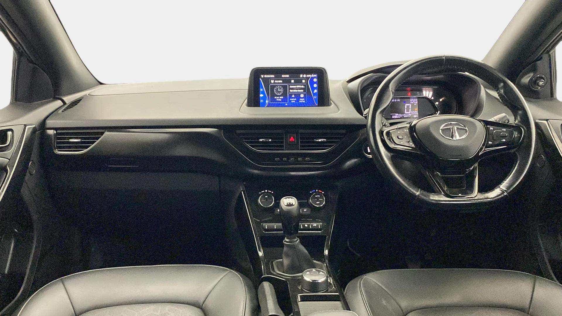 Dashboard and steering wheel view of a Tata Nexon 2017-2023