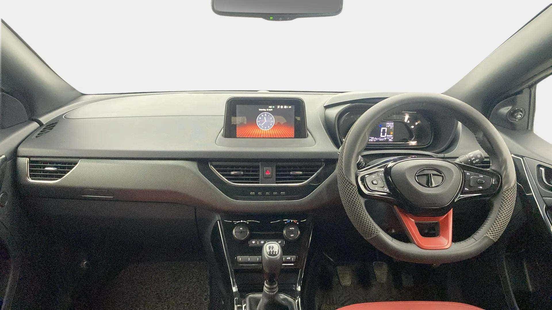 Dashboard and steering wheel view of a Tata Nexon 2017-2023