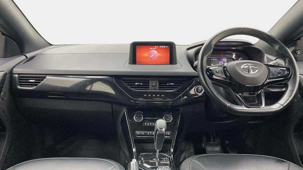 Dashboard and steering wheel view of a Tata Nexon 2017-2023