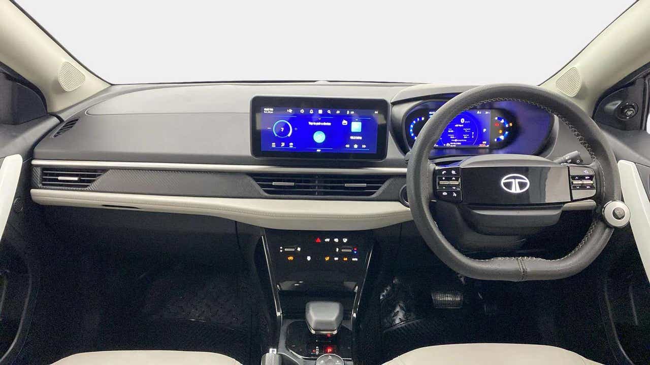 Dashboard and steering wheel view of a Tata Nexon
