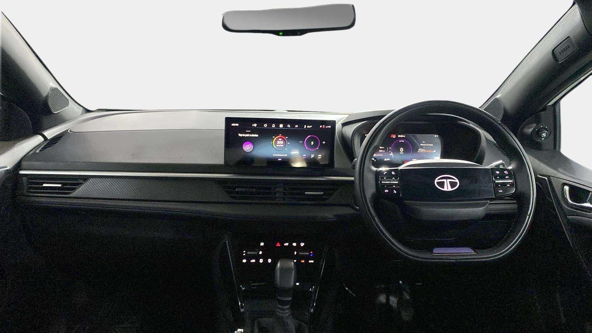 Dashboard and steering wheel view of a Tata Nexon 2017-2023