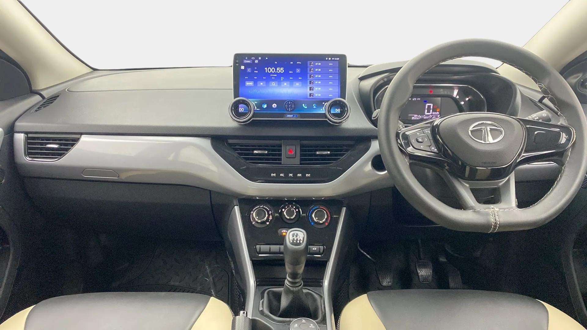 Dashboard and steering wheel view of a Tata Nexon 2017-2023