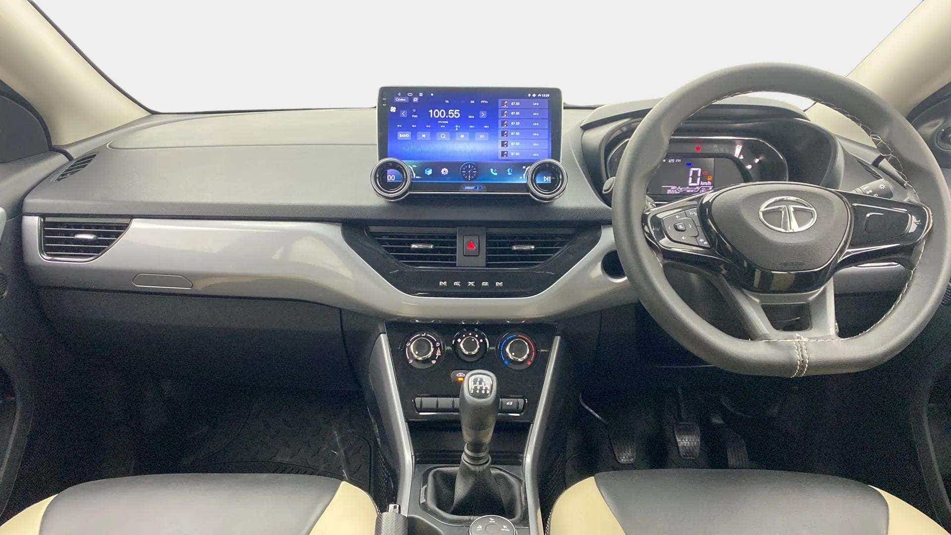 Dashboard and steering wheel view of a Tata Nexon 2017-2023