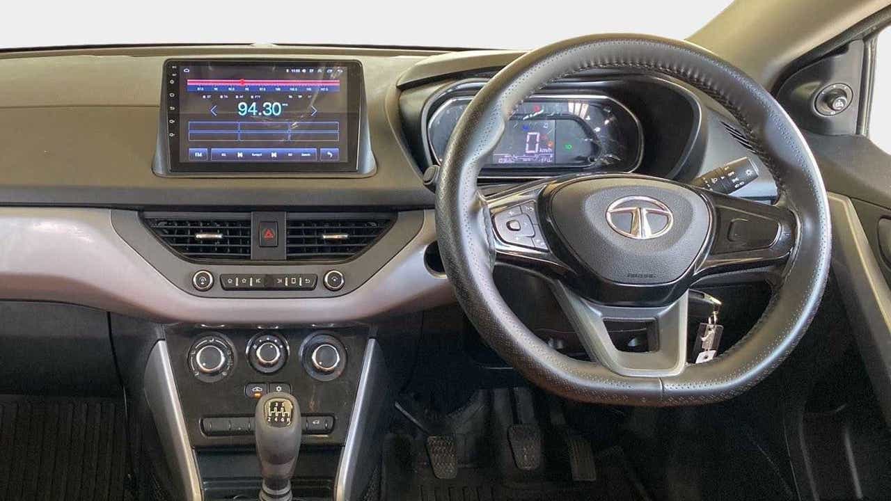 Dashboard and steering wheel view of a Tata Nexon 2017-2023