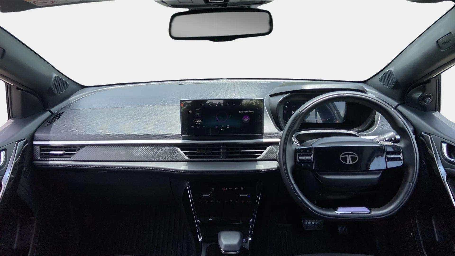 Dashboard and steering wheel view of a Tata Nexon