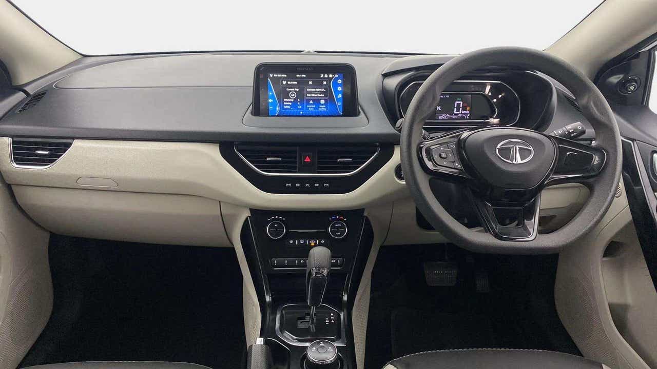Dashboard and steering wheel view of a Tata Nexon 2017-2023