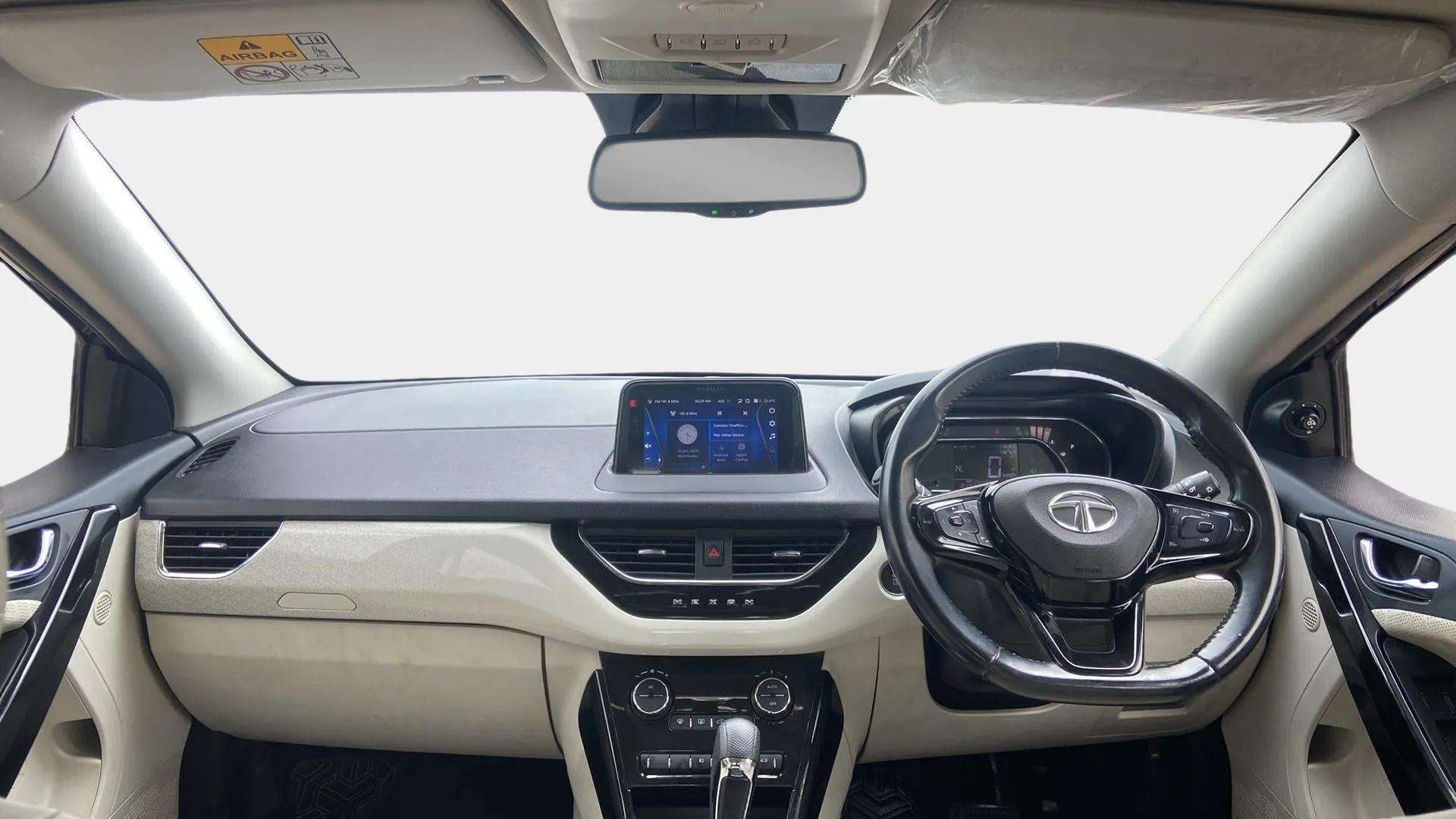 Dashboard and steering wheel view of a Tata Nexon 2017-2023