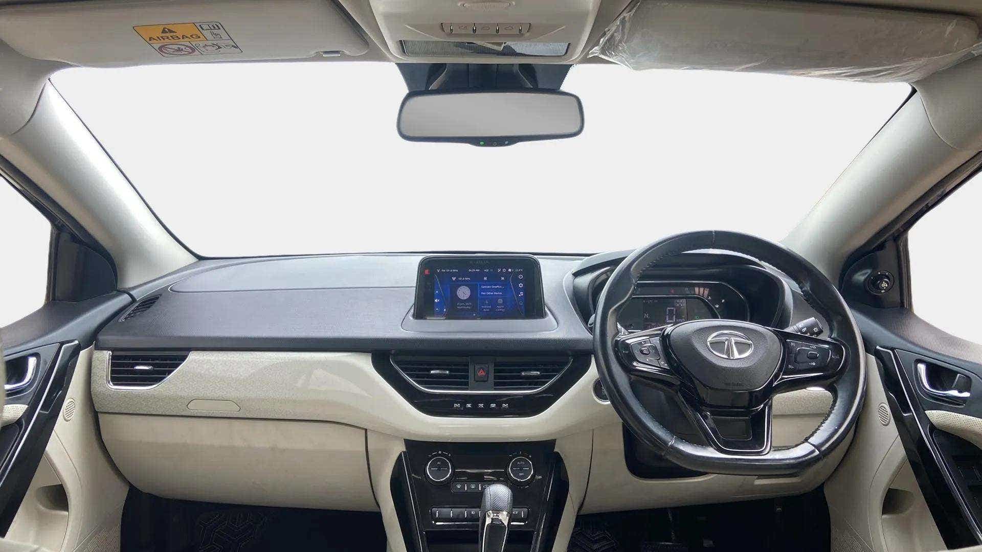 Dashboard and steering wheel view of a Tata Nexon 2017-2023