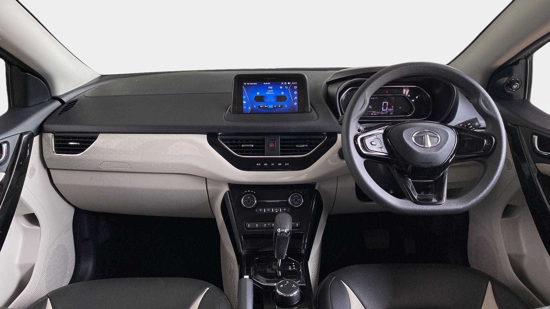 Dashboard and steering wheel view of a Tata Nexon 2017-2023