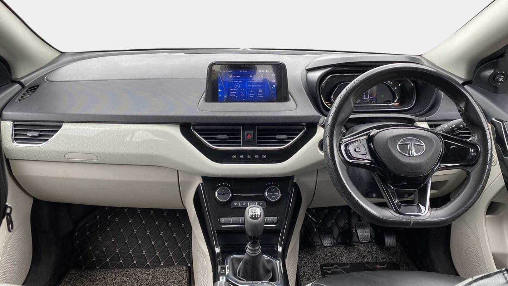 Interior dashboard and steering wheel of a Tata Nexon 2017-2023
