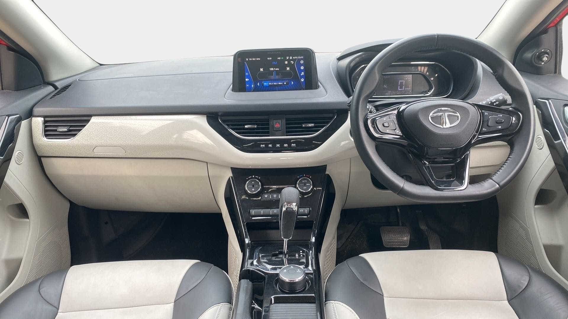 Dashboard and steering wheel view of a Tata Nexon 2017-2023