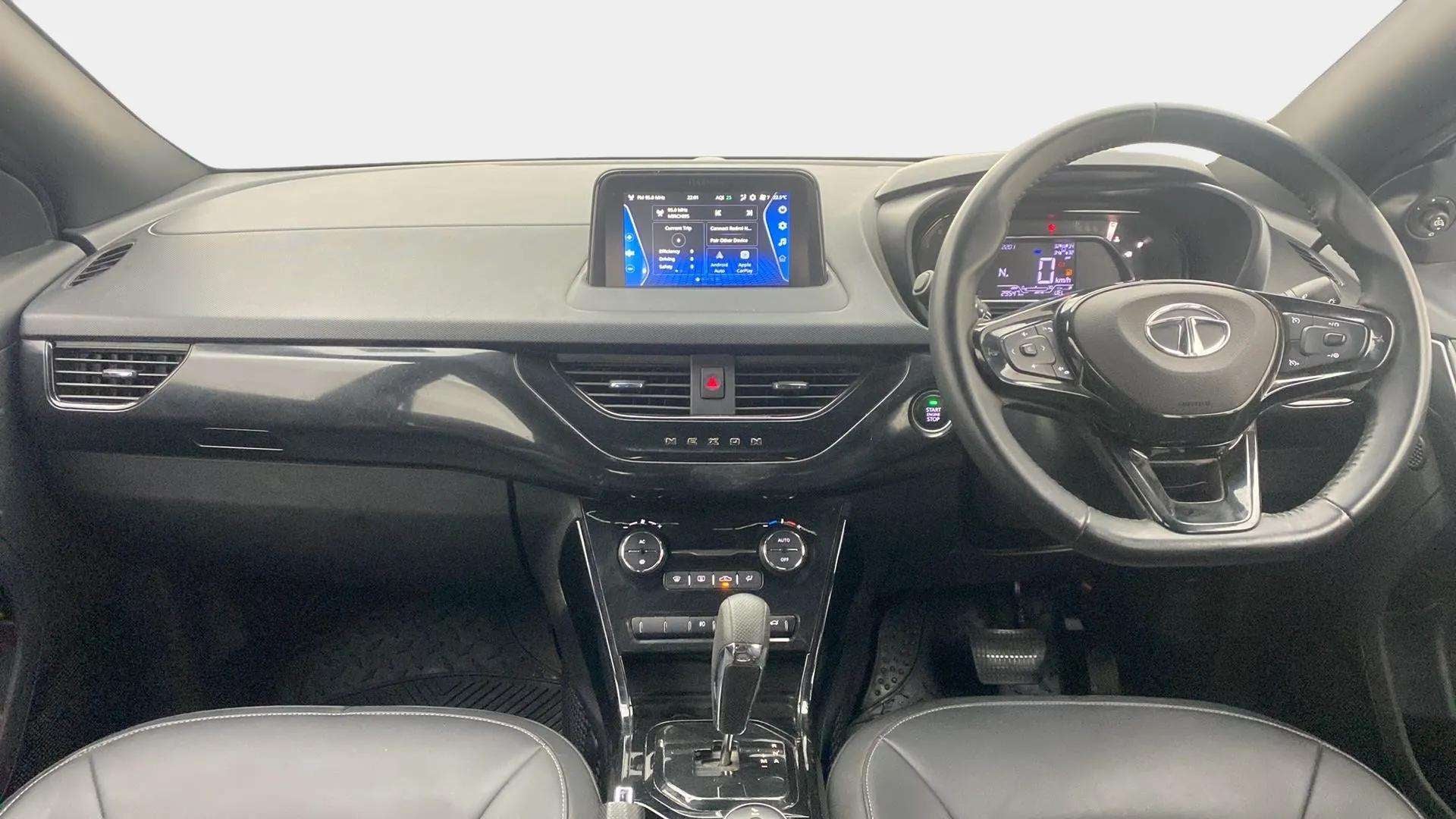 Dashboard and steering wheel view of a Tata Nexon 2017-2023