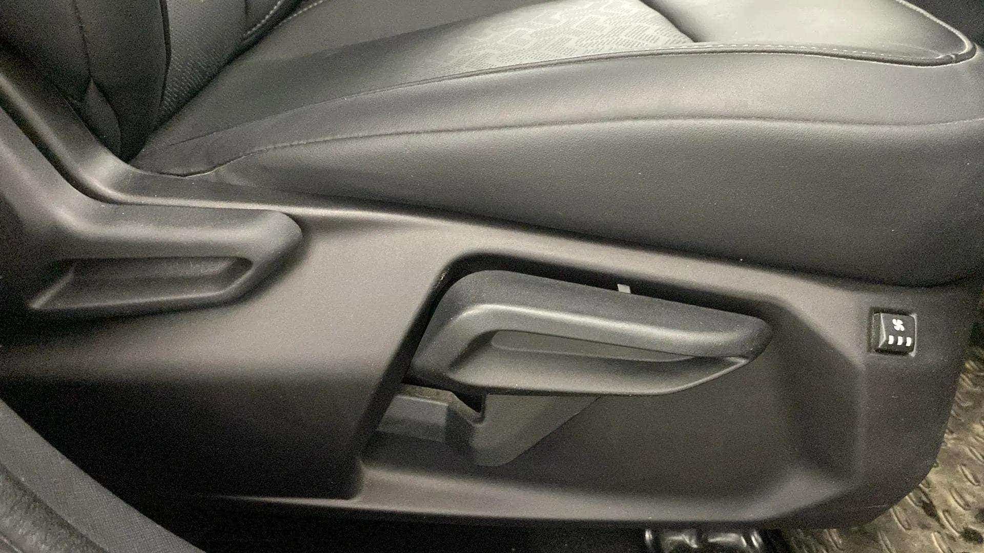 Side view of a Tata Nexon 2017-2023 seat adjustment lever