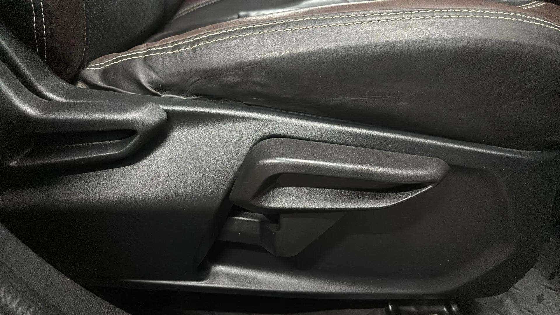 Interior seat adjustment lever of a Tata Nexon