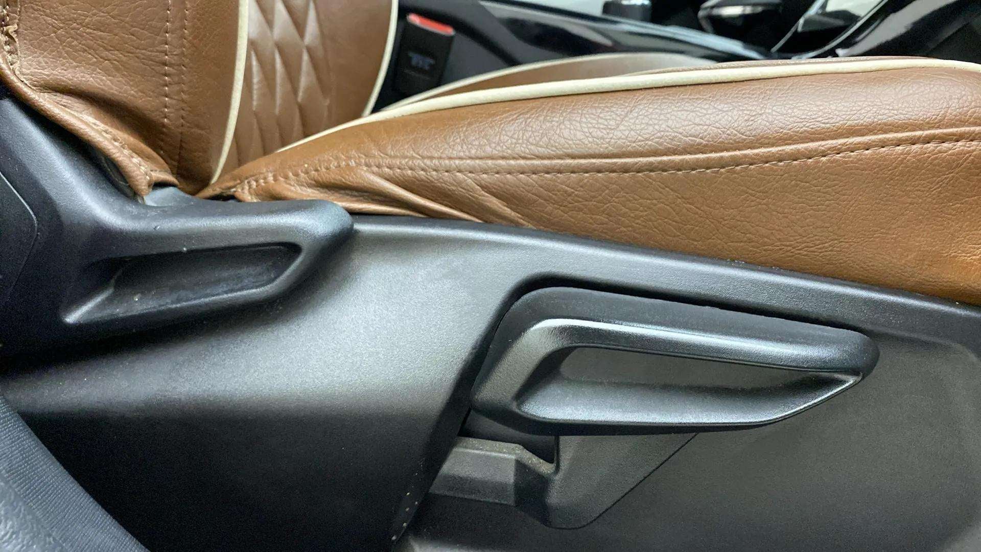 Close-up of seat adjustment lever in a Tata Nexon