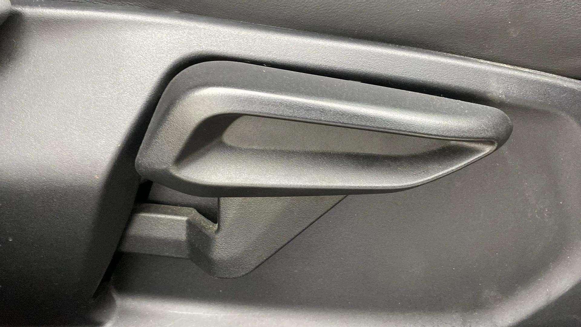 Close-up of interior door handle of a Tata Nexon