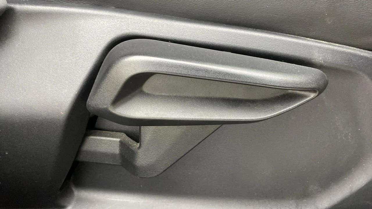 Close-up of interior door handle of a Tata Nexon