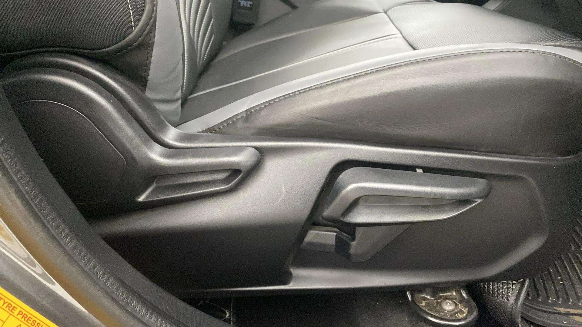 Side view of a Tata Nexon car seat adjustment lever