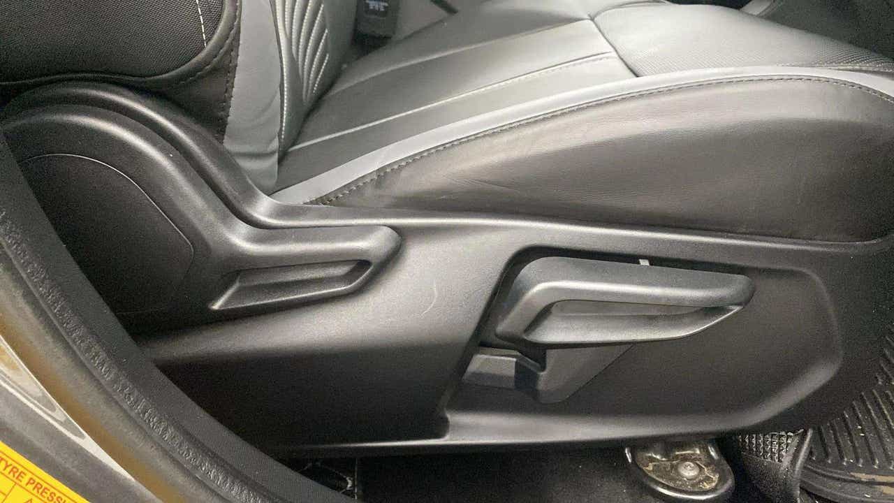 Side view of a Tata Nexon car seat adjustment lever