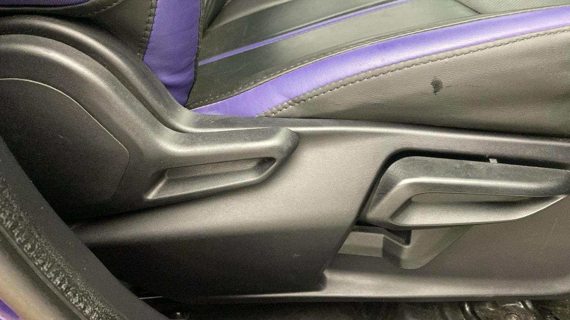 Close-up of seat adjustment lever of a Tata Nexon 2017-2023