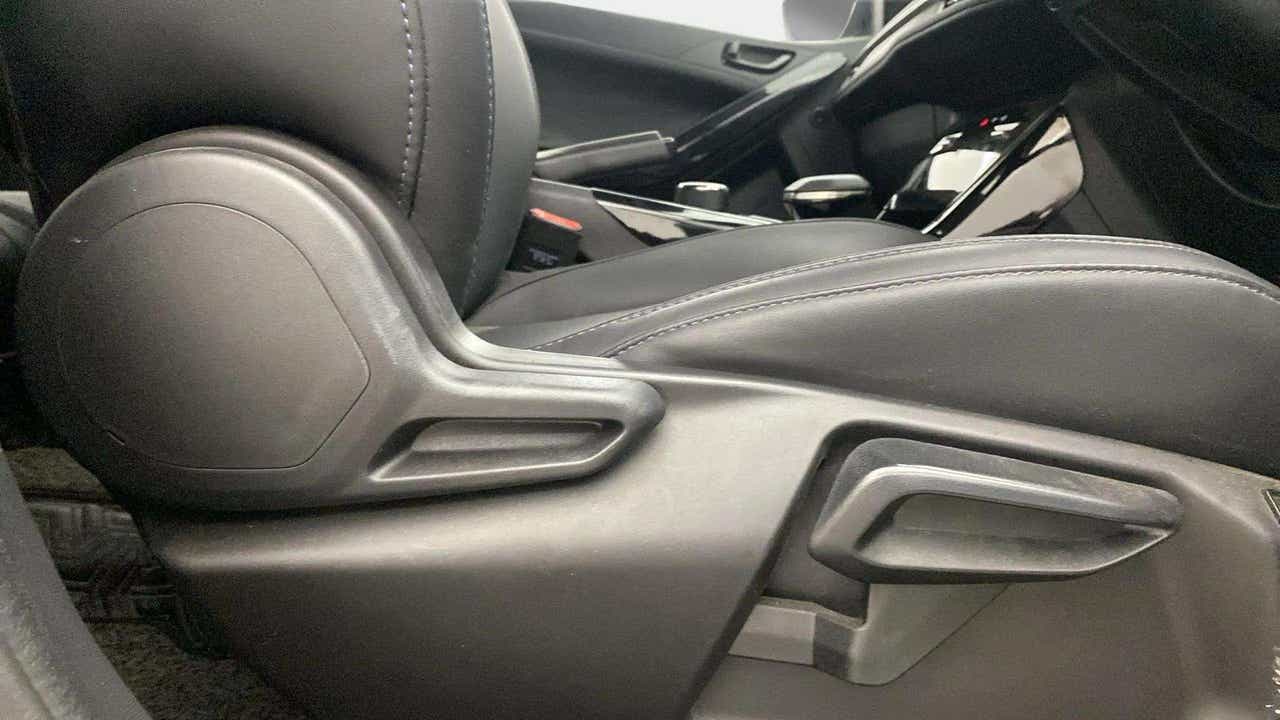 Close-up of the seat adjustment controls of a Tata Nexon
