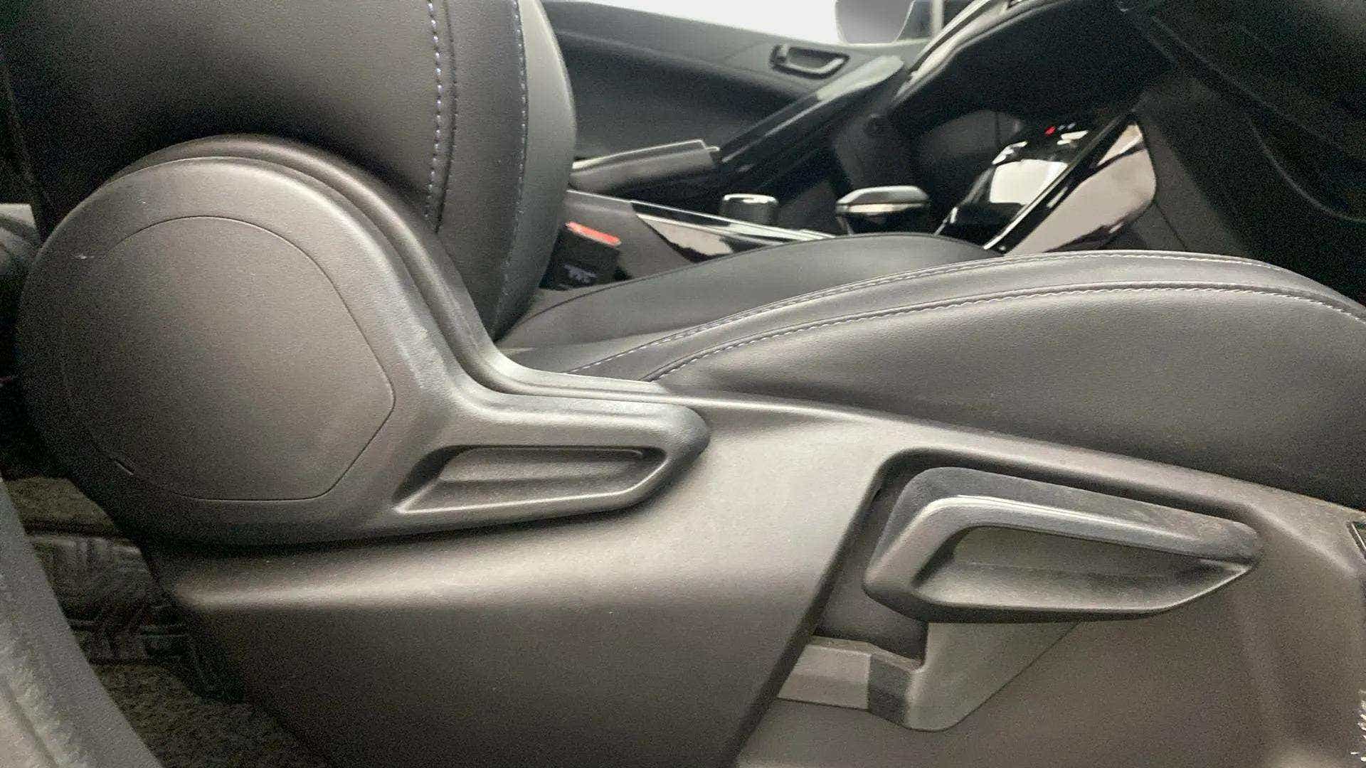 Close-up of the seat adjustment controls of a Tata Nexon