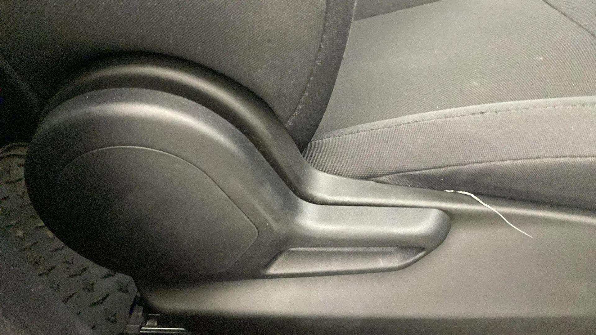 Close-up of a seat adjustment knob in a Tata Nexon