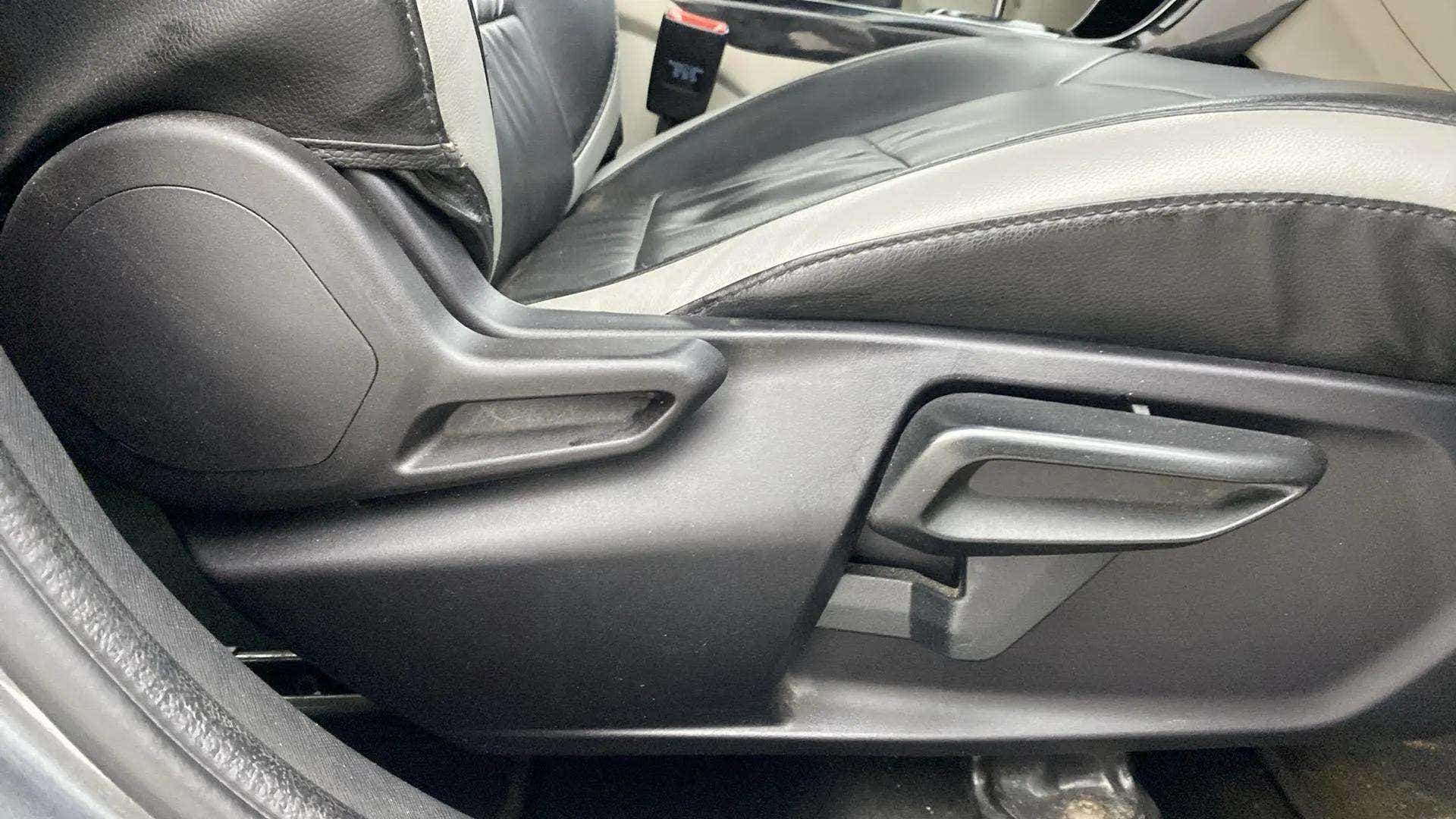 Side view of front seat adjustment lever of a Tata Nexon 2017-2023