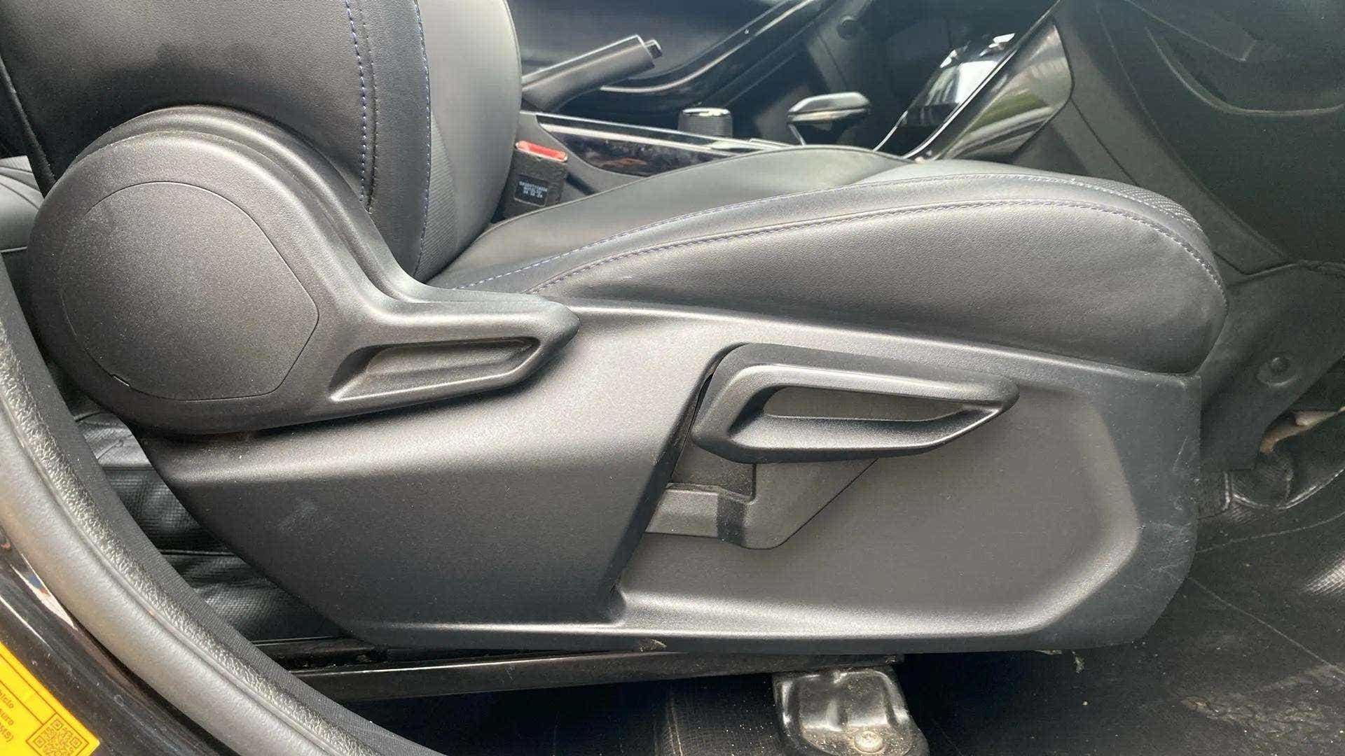 Side view of a Tata Nexon front seat adjustment lever