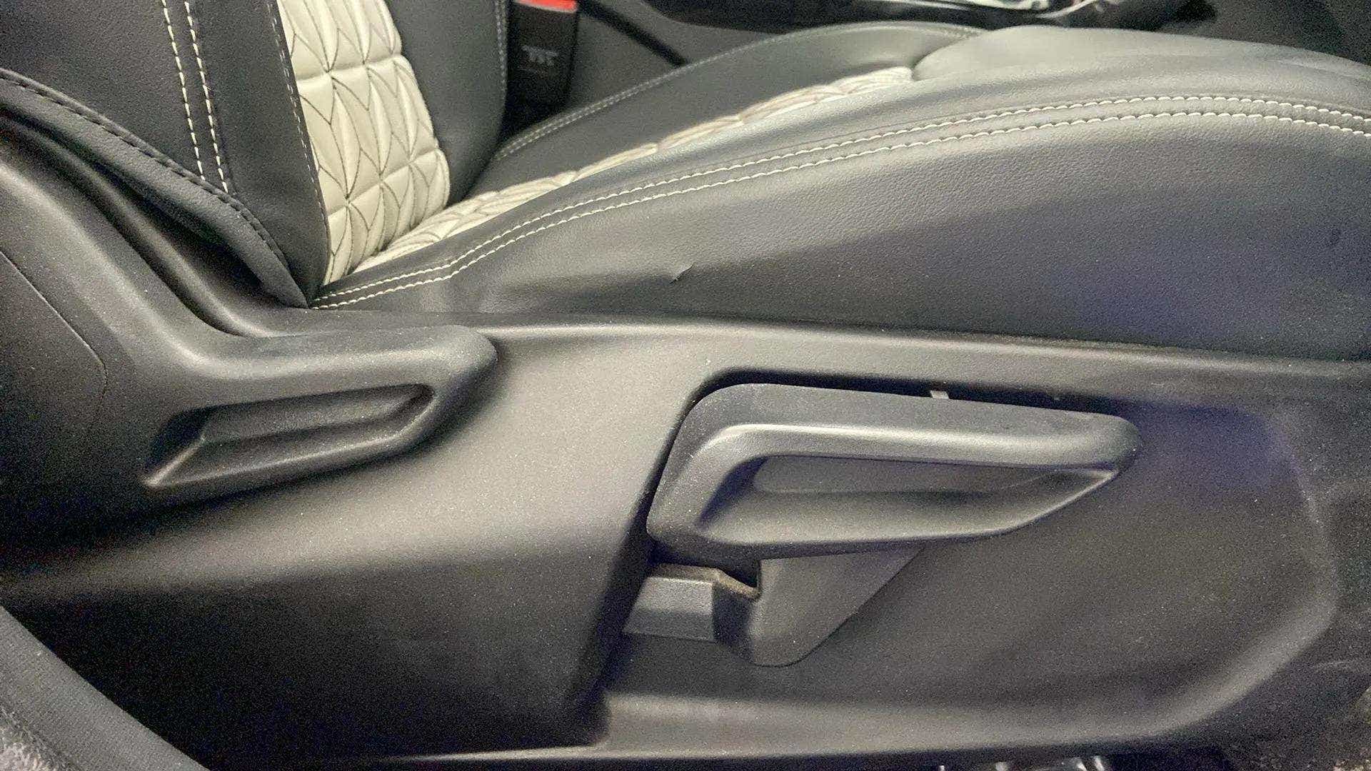Side view of a tata nexon 2017-2023 seat adjustment lever
