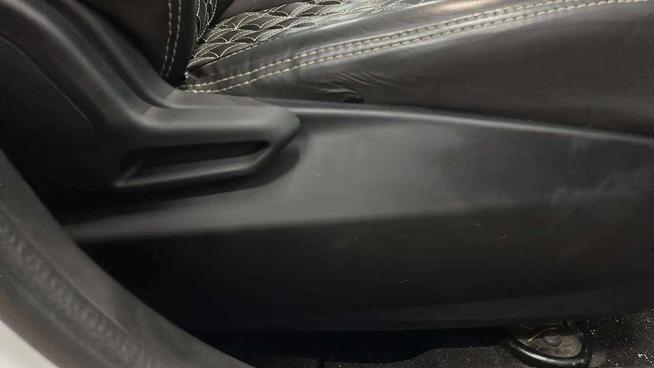 Close-up of the seat adjustment lever of a Tata Nexon
