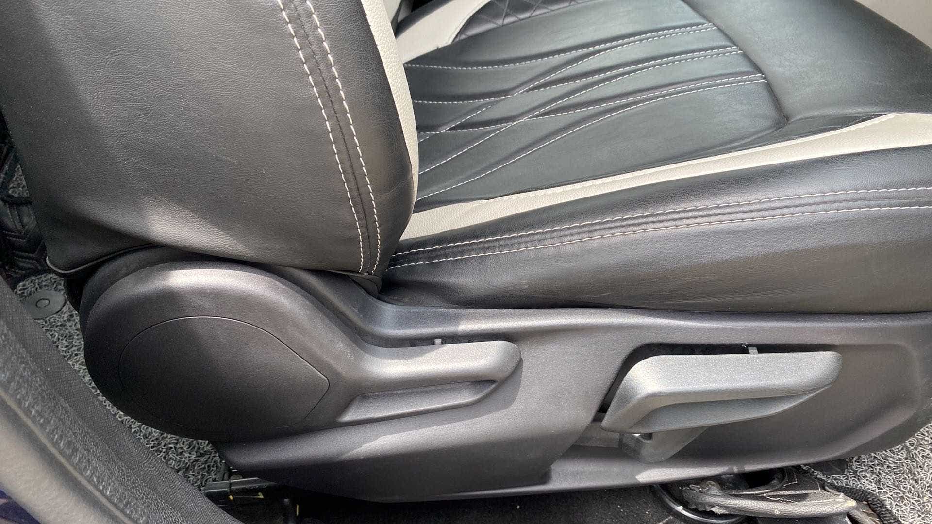 Front seat adjustment lever area of a Tata Nexon 2017-2023