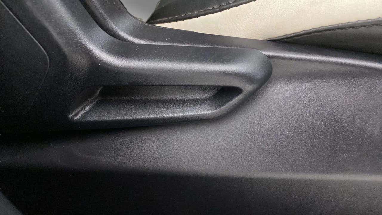 Close-up of a seat adjustment lever of a Tata Nexon 2017-2023