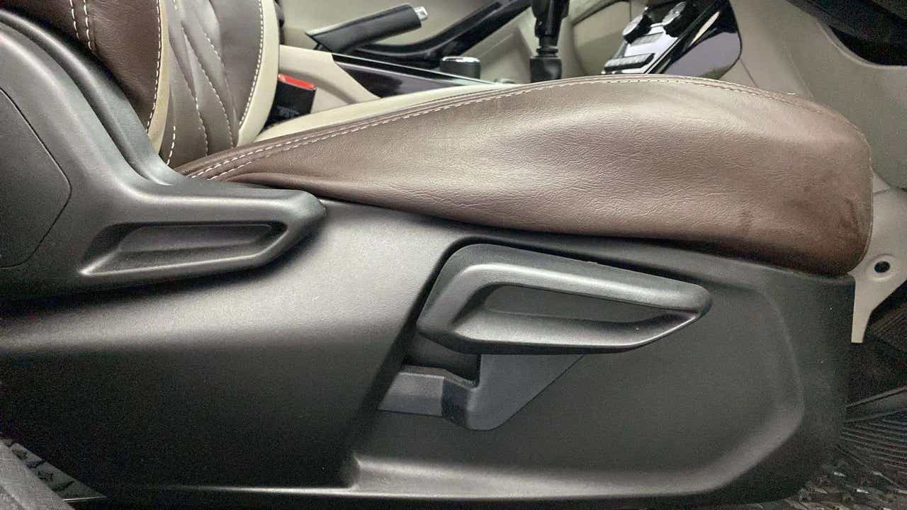Front seat adjustment lever close-up of a Tata Nexon 2017-2023