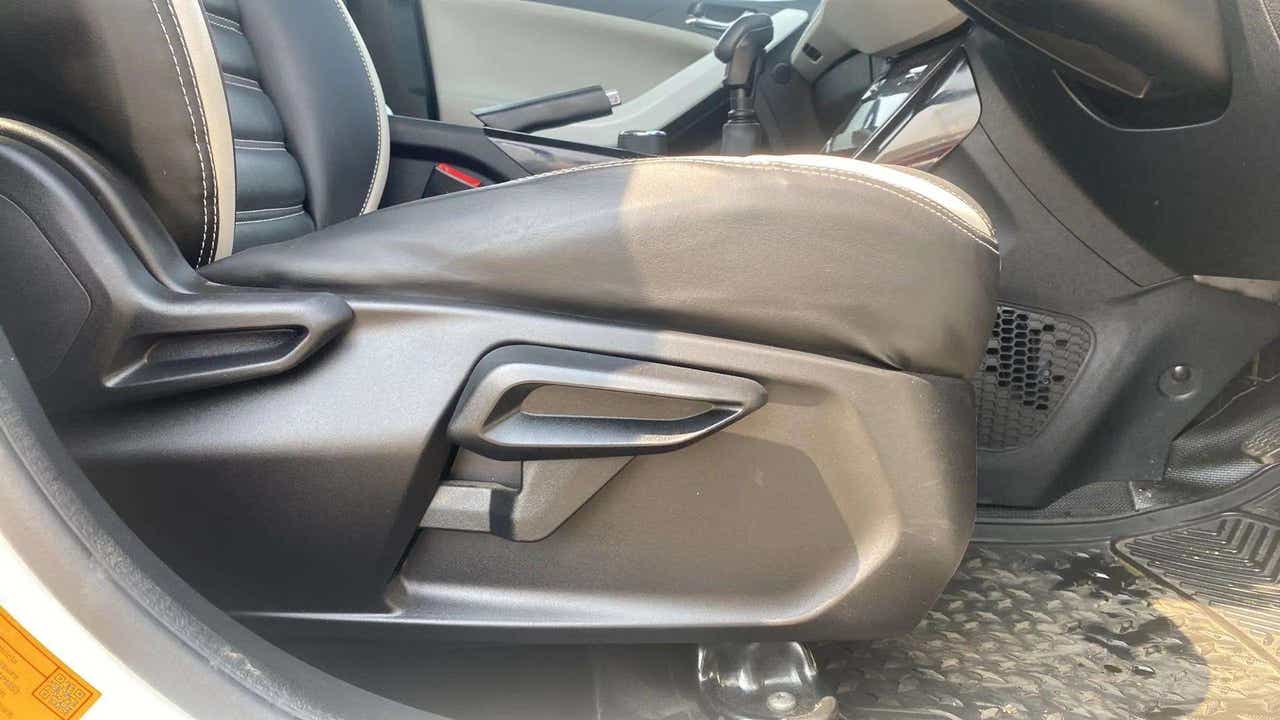 Front driver seat adjustment lever of a Tata Nexon