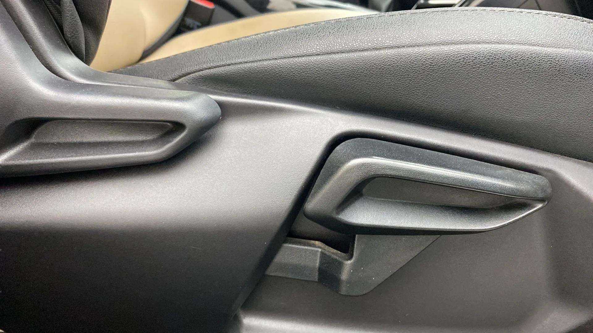 Close-up of seat adjustment lever of a Tata Nexon 2017-2023