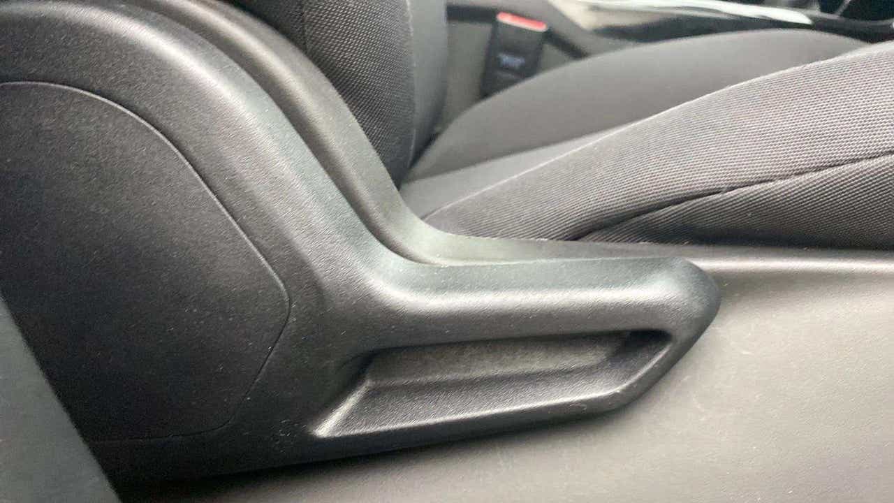 Close-up of the seat adjustment lever of a Tata Nexon 2017-2023