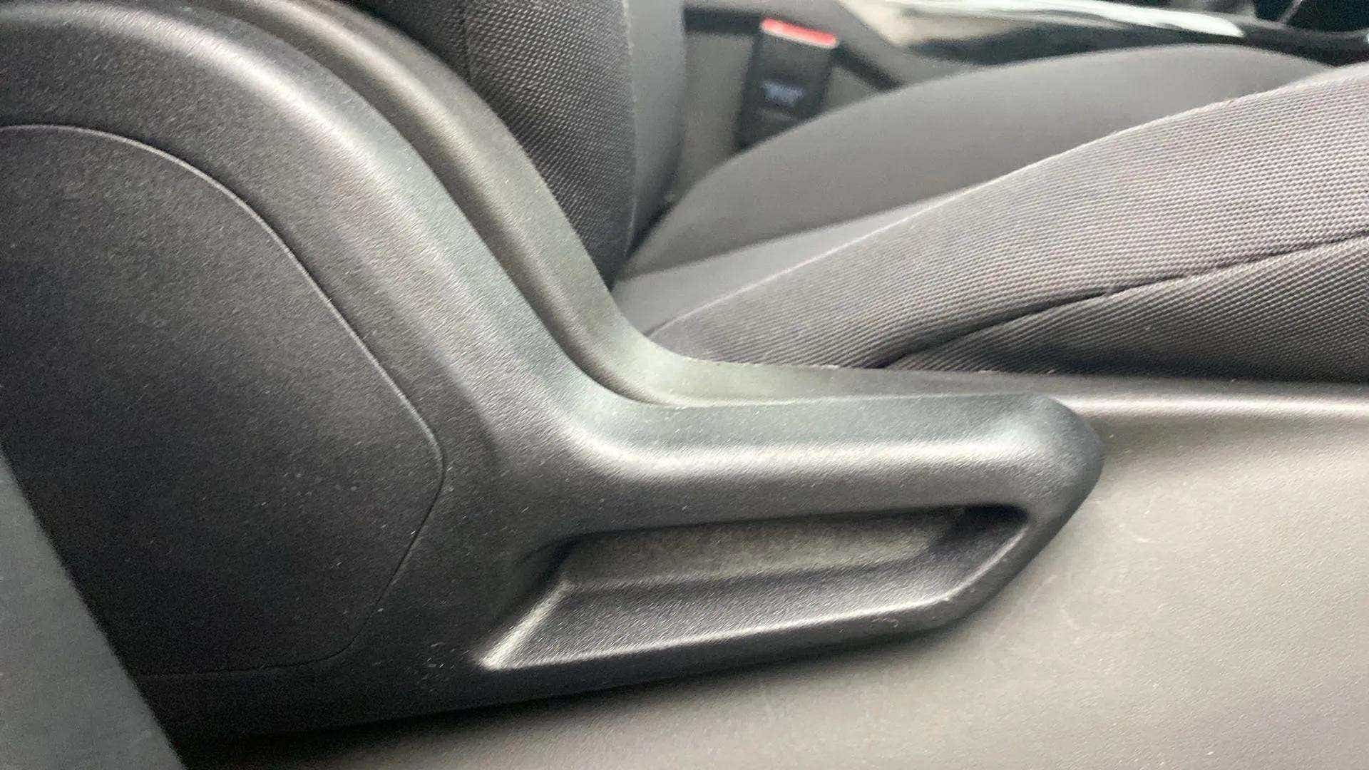 Close-up of the seat adjustment lever of a Tata Nexon 2017-2023