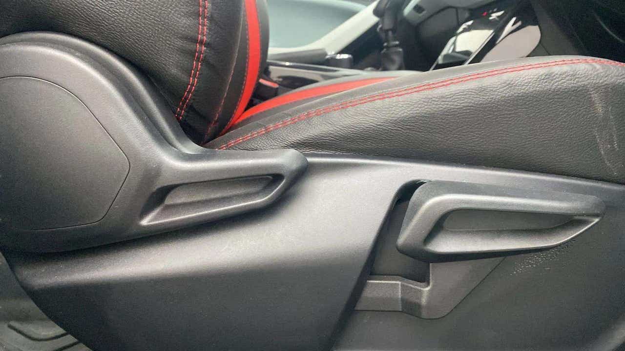 Close-up of the seat adjustment lever in a Tata Nexon