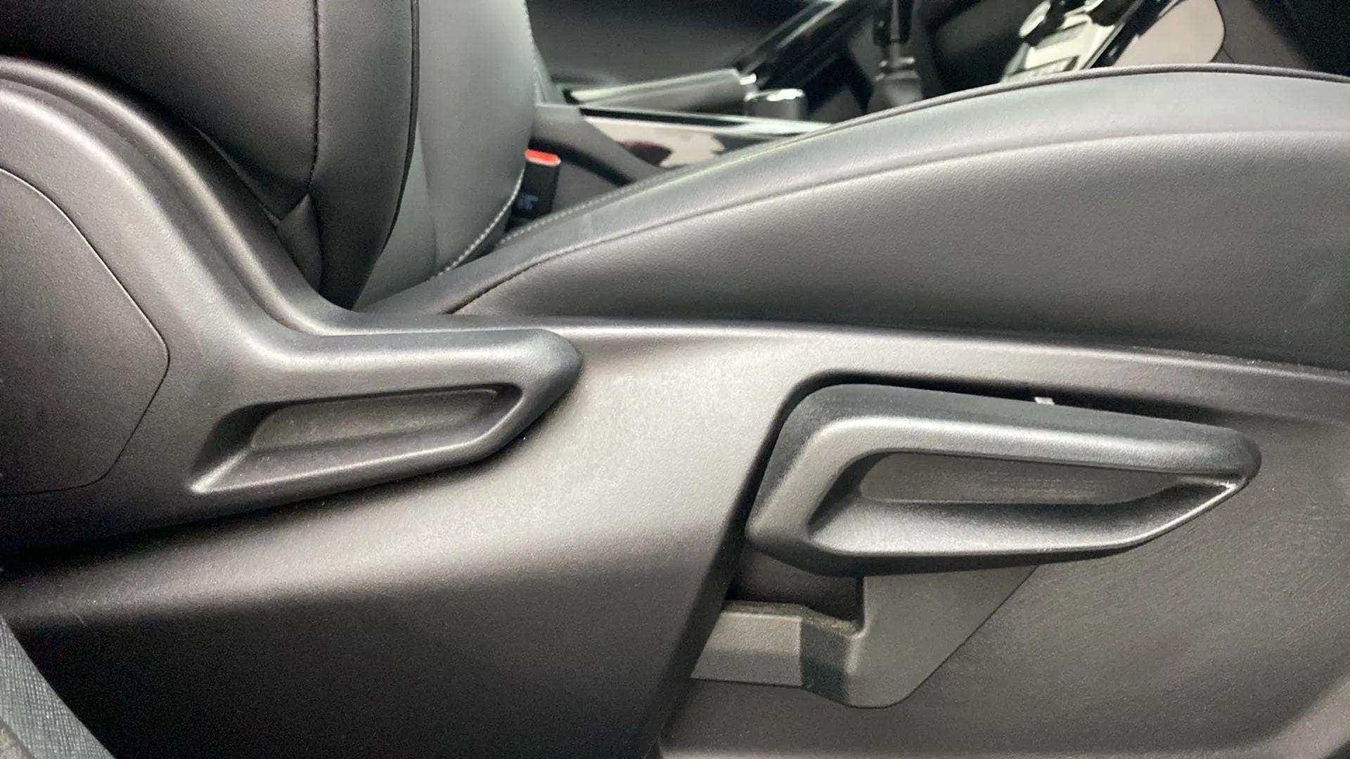 Close-up of seat adjustment lever in a Tata Nexon 2017-2023