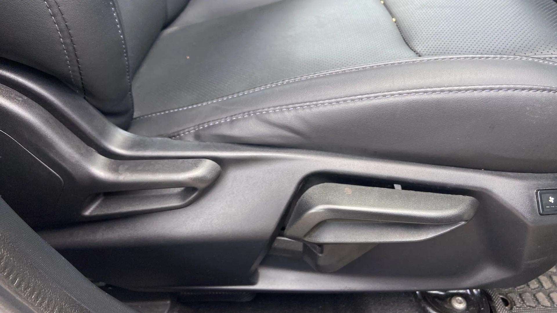 Driver seat adjustment controls of a Tata Nexon